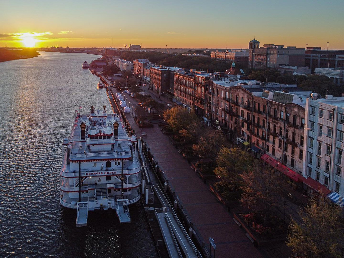 Evening view of the Savannah riverfront with the Georgia Queen riverboat in the foreground